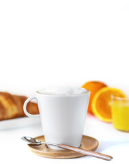 Breakfast concept with coffee, orange juice and croissant