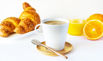 Breakfast concept with coffee, orange juice and croissants