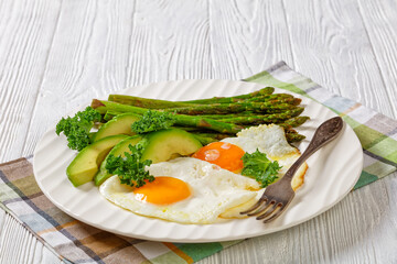 roast asparagus, ripe avocado and fried eggs