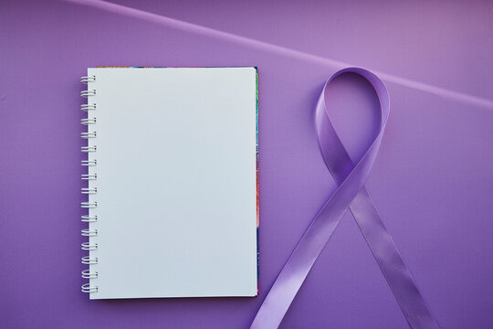 Mock of notepad and purple ribbon for Purple Day - World Epilepsy Day, March of 26. Symbol of Epilepsy Day