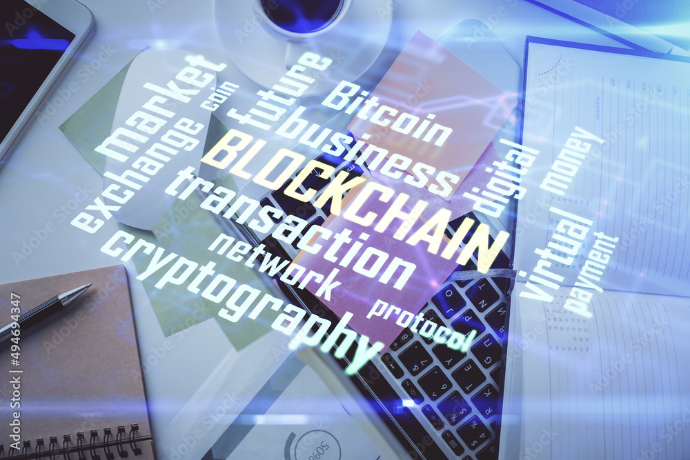 Poster blockchain theme hologram drawings over computer on the desktop background. top view. multi exposure