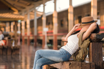 Beautiful young woman tourist travel holiday city street backpack adventure by train.