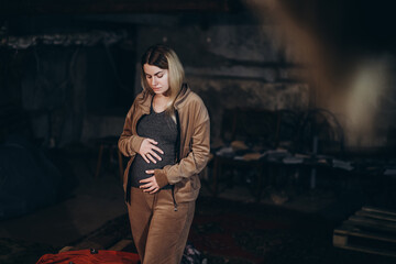 War in Ukraine. A Ukrainian pregnant woman hides in a bomb shelter while resisting a Russian...