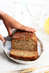 Woman Cutting Freshly Baked Banana Bread