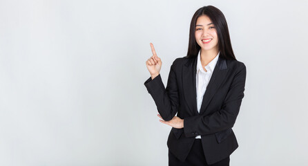 asian woman hands pointing to copy space for your promotional or text on white background.