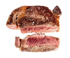 sliced medium rare cooked ribeye beef steak isolated on white background