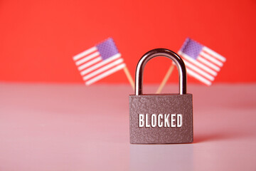Closed padlock with the inscription lock on the background of the flag of USA.