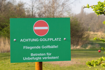 Sign for  Attention golf course! Flying golf balls!