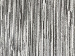 a light gray surface with vertical irregular stripes