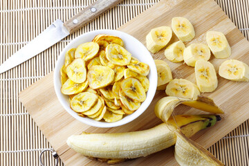 homemade dried banana chips in ceramic bowl