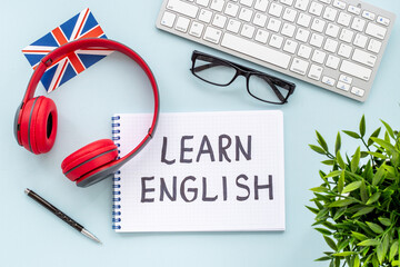 Learnging English concept. Handwritten text on notebook on student table