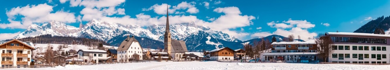 High resolution panorama with a church and the Hochkoenig summit in the background at Maria Alm, Salzburg, Austria