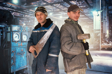 Two bad unskilled workers in bad dirty tattered uniform with bad tools. Concept of unskilled...