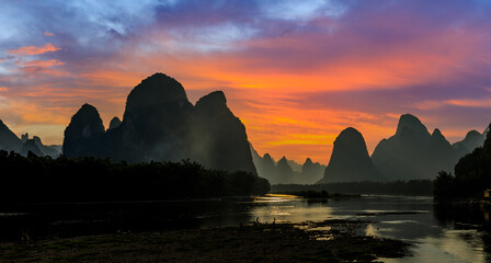 Beautiful mountain and river with cloud nature landscape in Guilin at sunset, China. Guilin is a world famous tourist resort. Here are the most widely distributed karst landforms in China.