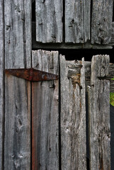 rusty barn door hinge rotting wood