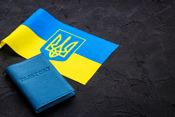 Ukrainian refugees migration concept. Ukaraine flag and passpotrs