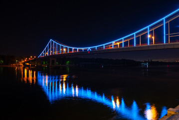 Night view of pedestrian bridge on Dnipro in Kiev Ukraine