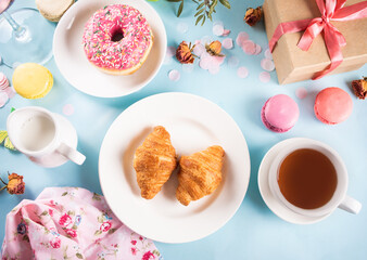 Fresh baked croissants and cup of tea. Healthy lifestyle concept.