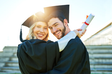 Its a big milestone in our relationship as well. Portrait of two students on graduation day.