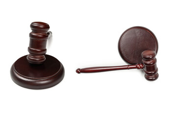 Wooden judge gavel and soundboard isolated on a white background.