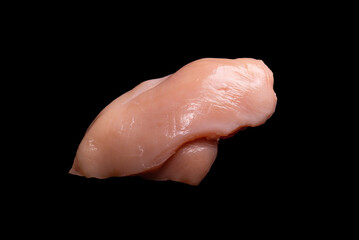 Raw chicken fillet isolated on a black background.