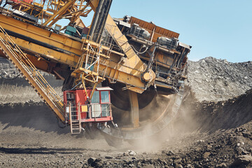 Coal mining in surface mine. Huge bucket excavator during mining..