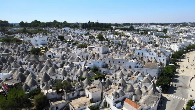 Aerial drone shot of beautiful small town Alberobello, Italy. whitewashed stone huts with conical roof