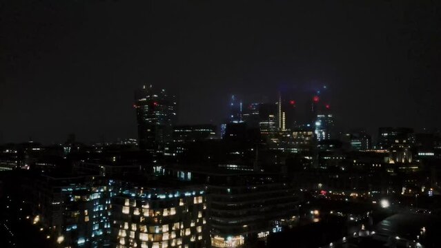Aerial shot of the city of London during a foggy night