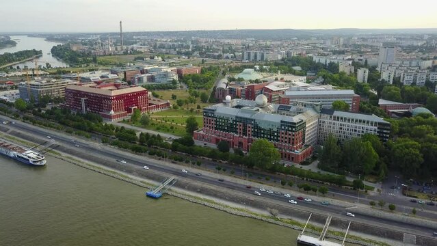Cinematic 4K aerial drone footage of L&aacute;gym&aacute;nyosi ELTE Campus Southern Block, University of Technology and Economics, Kopaszi-g&aacute;t by the Danube river in Budapest, Hungary