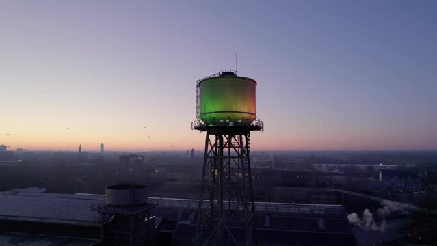 Aerial view of Water tower in Bochum city, Germany. Industrial heritage of Ruhr region, dawn drone orbit