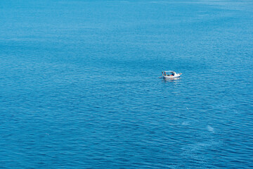 Fototapeta premium seascape with a lonely fishing boat, view from above