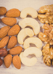 Various nuts and almonds, healthy nutrition and lifestyle. Vintage photo