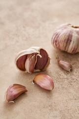 Garlic is an ingredient for carbonara paste on a beige background