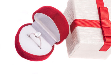 diamond engagement ring in heart shaped red box isolated on white