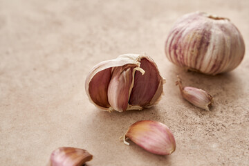Garlic is an ingredient for carbonara paste on a beige background