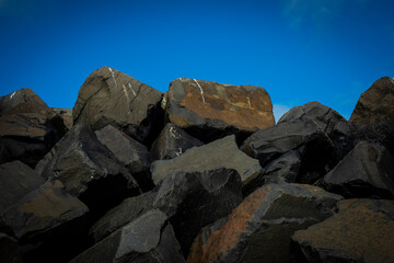 Rocks on beach with clear sky