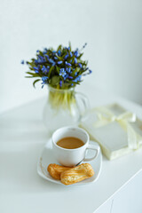 cup of tea and a bouquet of flowers