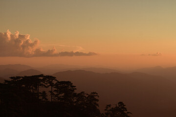 sunset with mountains in the background
