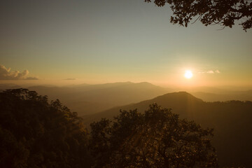 sunset with mountains in the background