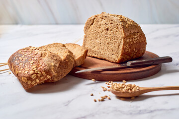 Fresh loaf of homemade sourdough rye bread in slices.