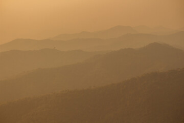 sunset with mountains in the background