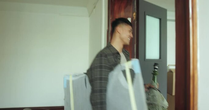 Asian Adult Male Moving into New Home Carrying Cardboard Boxes up Staircase