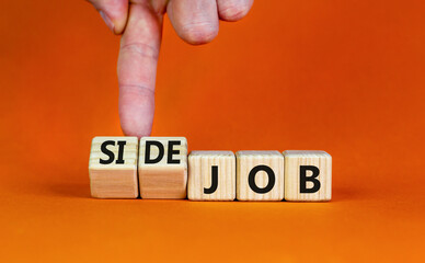 Side job symbol. Businessman turns wooden cubes and changes concept words Job to Side job....
