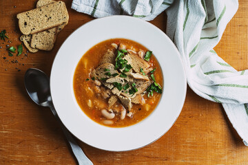 Bowl of lentils soup with beans