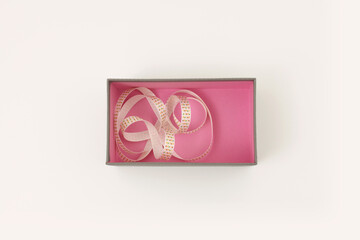 Craft empty gift boxes with ribbon on beige copy space horizontal  background. Top view, flat lay.