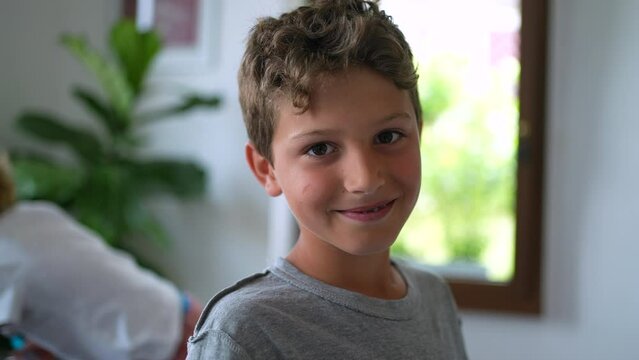 One young boy looking at camera handsome child kid face
