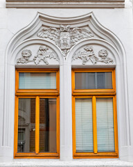 A couple of art nouveau house windows with decorated frame, Saxony, Germany