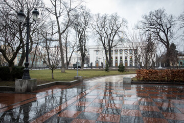 Deserted Mariinsky park and the building of the Ukrainian Parliament (Verkhovna Rada) on the first...