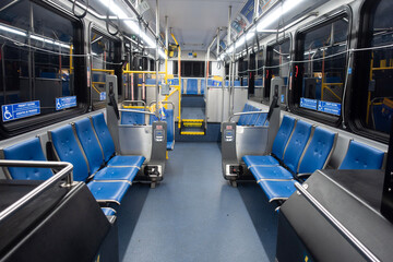 Interior of lighted city bus at night transit