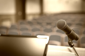 Rostrum in conference hall with microphone and computer